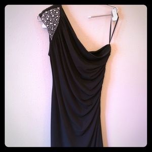 One shoulder black dress with beading.